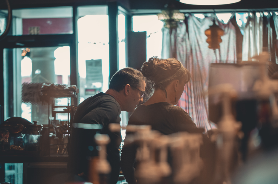 man and woman looking through the shop